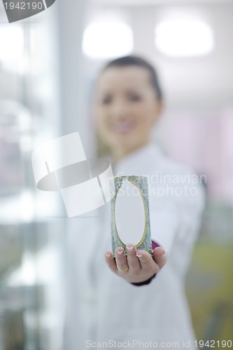 Image of pharmacist chemist woman standing in pharmacy drugstore