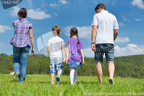 Image of happy young family have fun outdoors