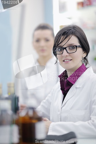 Image of team of pharmacist chemist woman  in pharmacy drugstore