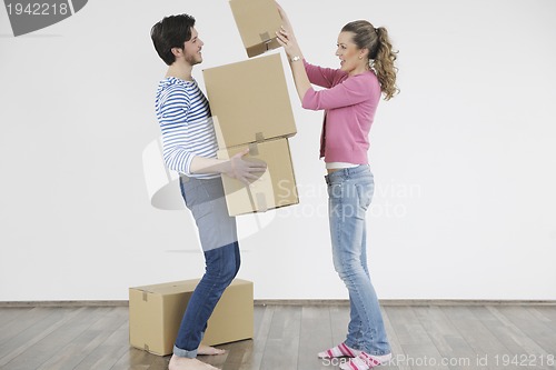 Image of Young couple moving in new home