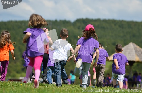 Image of happy kids group  have fun in nature
