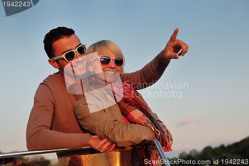 Image of couple in love  have romantic time on boat