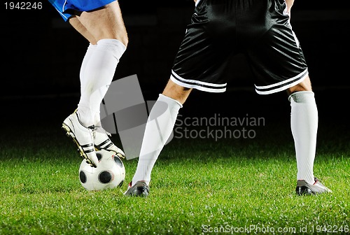 Image of football players in action for the ball