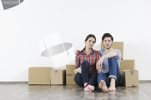 Image of Young couple moving in new home