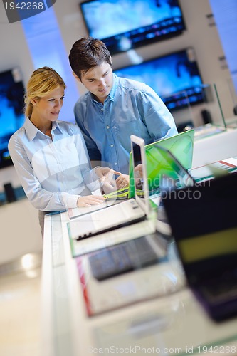 Image of people buy  in consumer electronics store