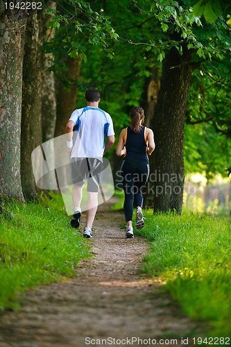 Image of Young couple jogging