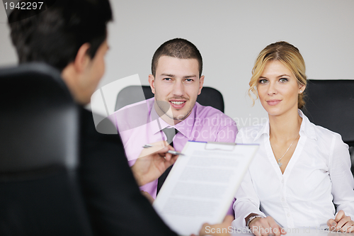 Image of Group of young business people at meeting