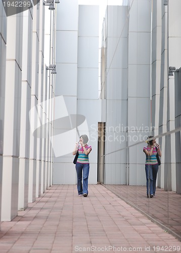 Image of beautiful young woman in the city