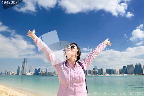 Image of happy tourist woman