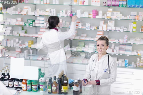 Image of team of pharmacist chemist woman  in pharmacy drugstore