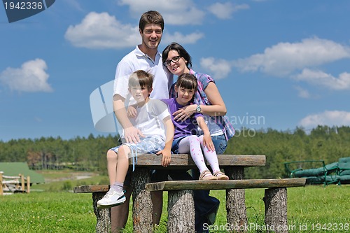 Image of happy young family have fun outdoors