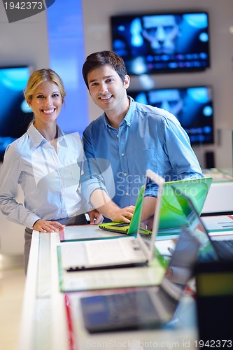 Image of people buy  in consumer electronics store