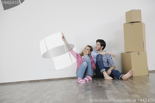 Image of Young couple moving in new home