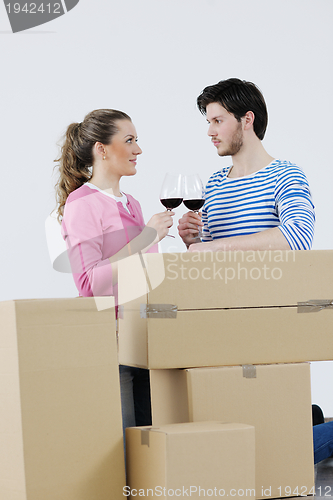 Image of Young couple moving in new home