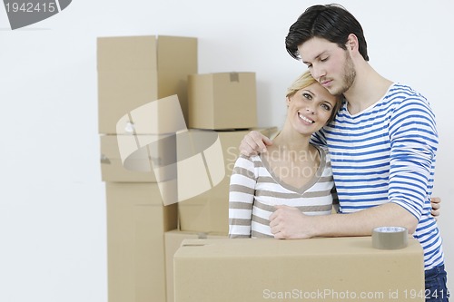 Image of Young couple moving in new home