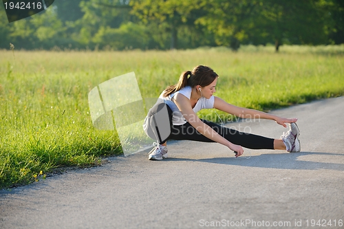 Image of woman stretching before fitness