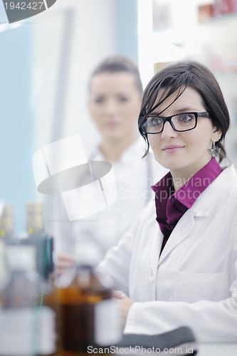 Image of team of pharmacist chemist woman  in pharmacy drugstore