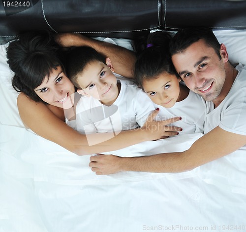 Image of happy young Family in their bedroom