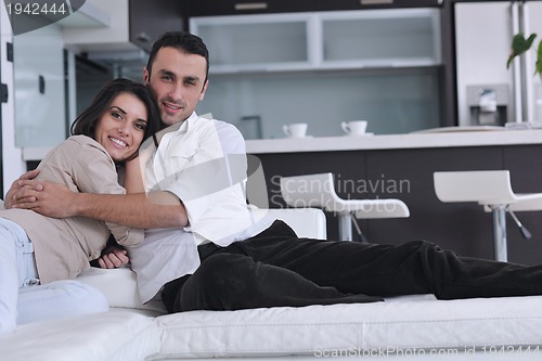 Image of happy young couple relax at home