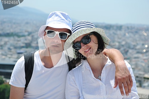 Image of happy young couple tourists in greece