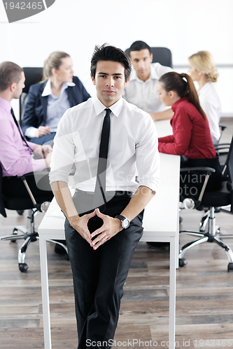 Image of young business man at meeting