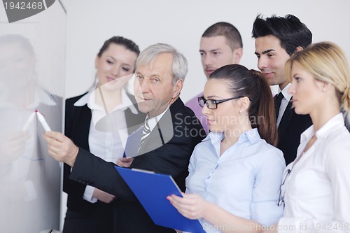 Image of Senior business man giving a presentation