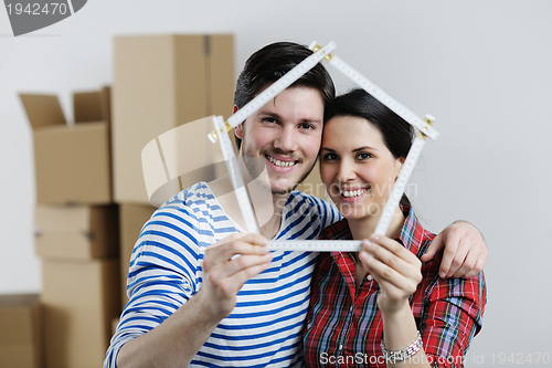 Image of Young couple moving in new house