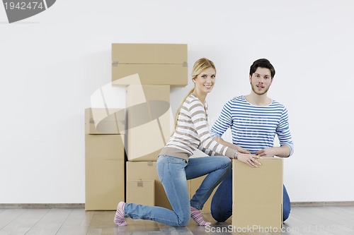 Image of Young couple moving in new home