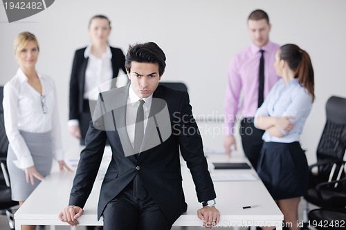 Image of young business man at meeting