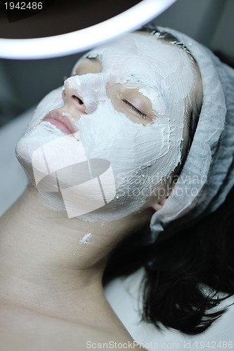 Image of woman with facial mask in cosmetic studio