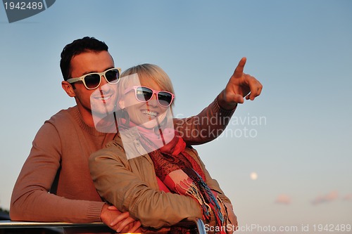 Image of couple in love  have romantic time on boat