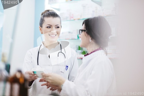 Image of team of pharmacist chemist woman  in pharmacy drugstore