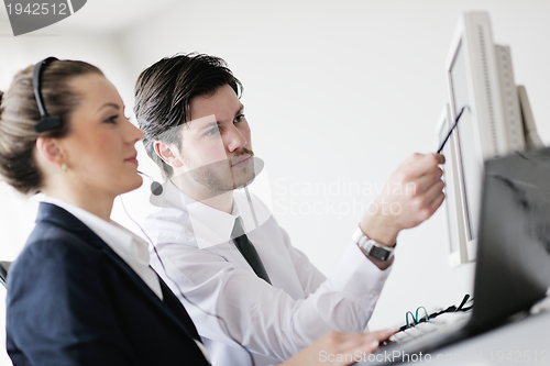 Image of business people group working in customer and help desk office