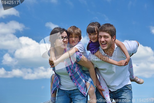 Image of happy young family have fun outdoors