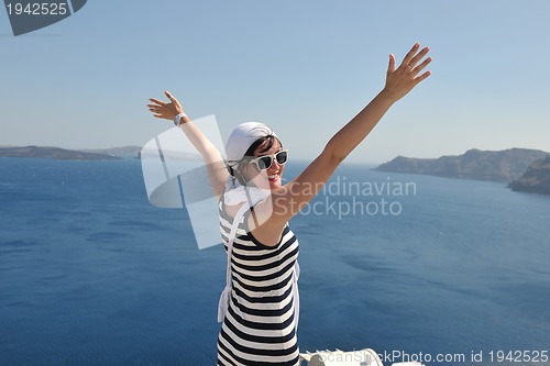 Image of Greek woman on the streets of Oia, Santorini, Greece