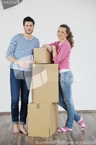 Image of Young couple moving in new house