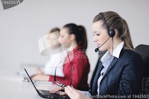 Image of business woman group with headphones