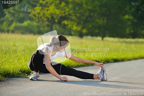 Image of woman stretching before fitness
