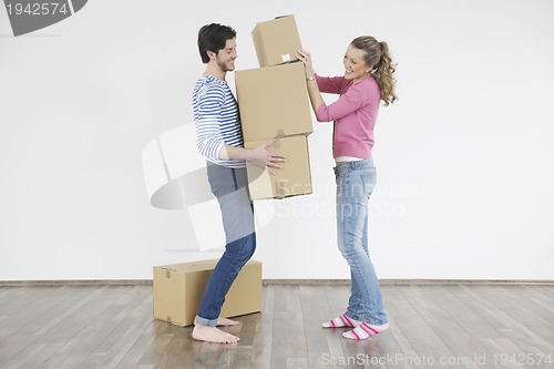 Image of Young couple moving in new home