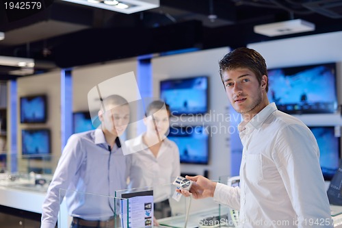 Image of people buy  in consumer electronics store