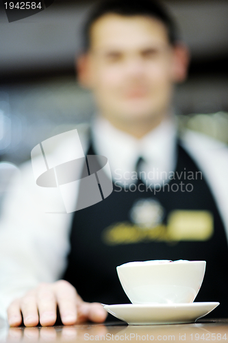 Image of Barista prepares cappuccino