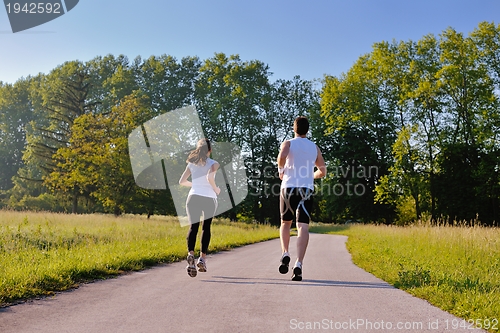 Image of Young couple jogging