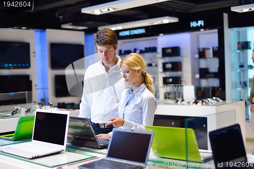 Image of people buy  in consumer electronics store