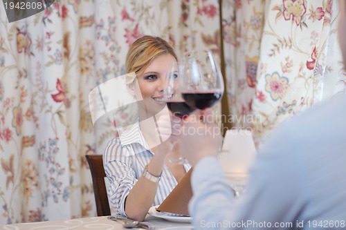 Image of young couple having dinner at a restaurant