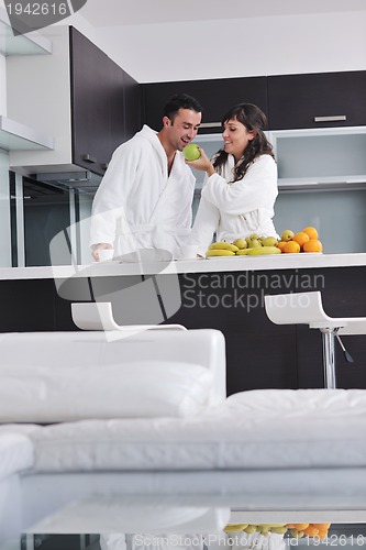Image of young couple have fun in modern kitchen