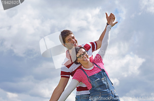 Image of romantic young couple in love together outdoor