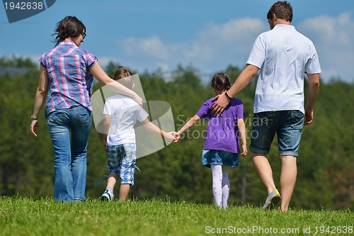 Image of happy young family have fun outdoors
