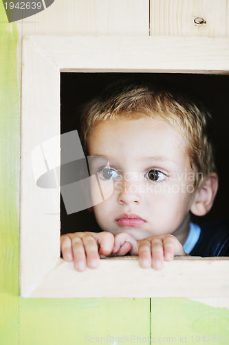 Image of happy child in a window