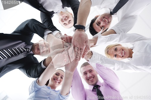 Image of business people group joining hands