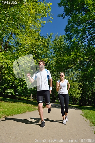 Image of Young couple jogging